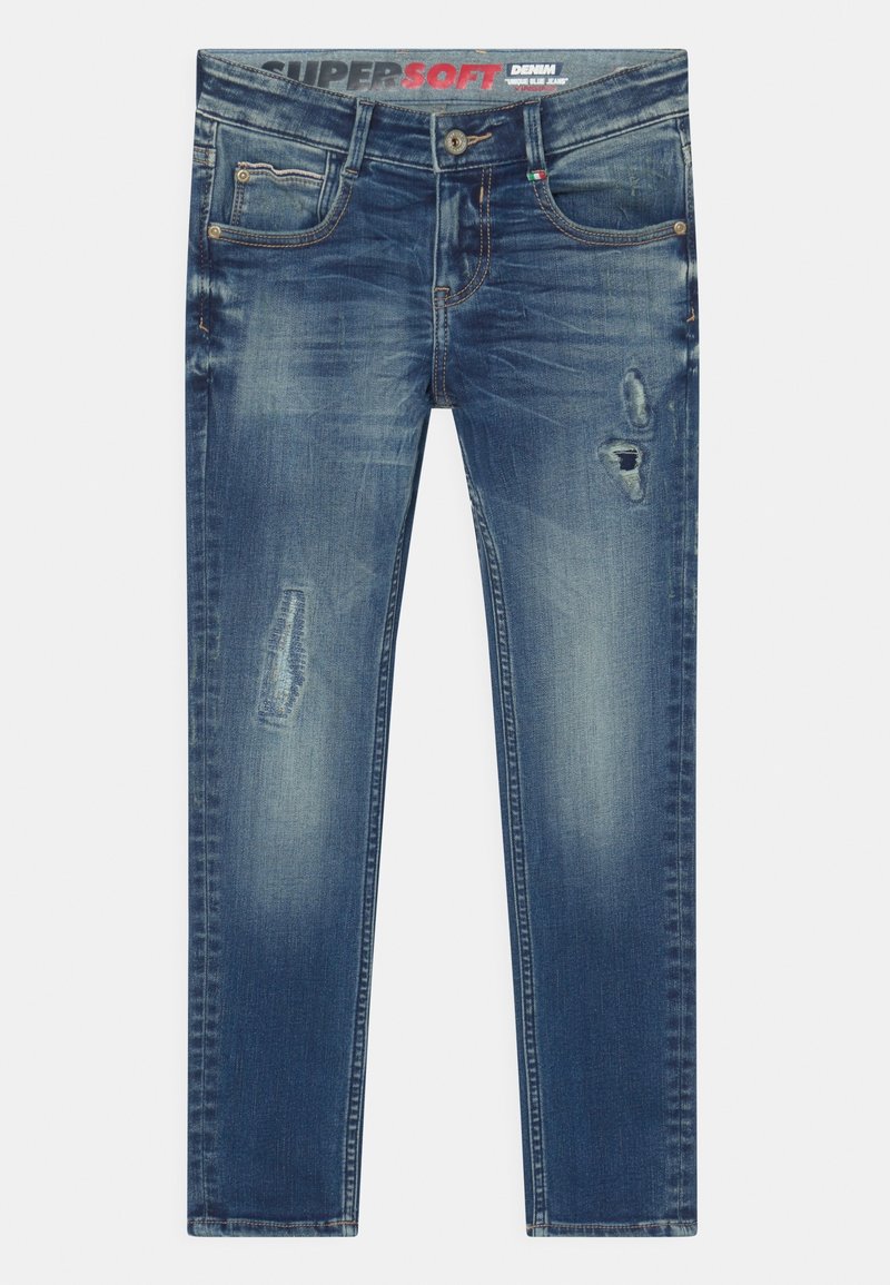 Vaqueros de mezclilla azul con un corte ajustado, zonas descoloridas y desgastadas en los muslos, bolsillos delanteros y cierre de botón en la cintura.