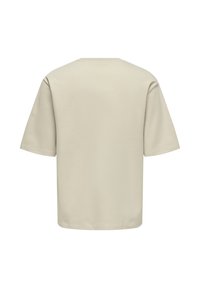 T-shirt en coton beige à manches courtes et col rond. Texture lisse, coupe décontractée et dos sans coutures.