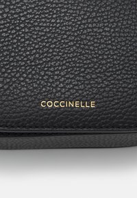 Coccinelle Rankinė - noir