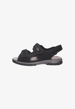 Black sandal with adjustable Velcro straps, breathable design, padded footbed, and textured outsole for traction. Features side cutouts.