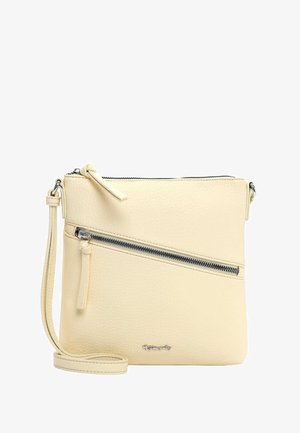 Petit sac bandoulière beige avec surface texturée, poche zippée diagonale à l'avant et sangle réglable. Logo de la marque en argent près de la base.