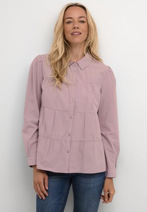 Light purple button-up shirt with a collar, featuring a tiered design and long sleeves. Smooth texture with subtle gathered accents.