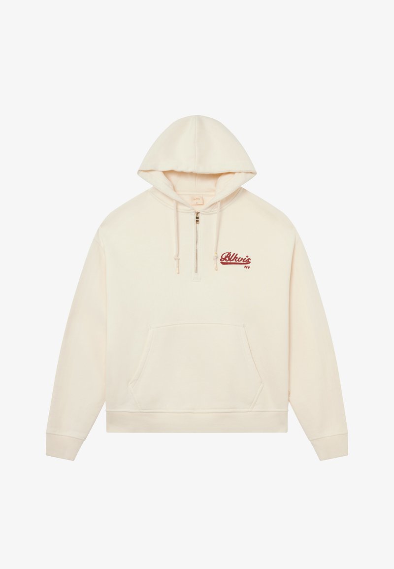 Hoodie couleur crème avec une poche kangourou, demi-fermeture éclair et logo brodé rouge sur la poitrine. Tissu doux et coupe régulière.