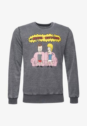 Sudadera gris con un gráfico de dos personajes animados sentados en un sofá rosa, delineados en negro con acentos amarillos en el fondo.