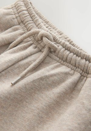 Pantaloni sportivi bej, cu talie elastică cu șnur, textură moale a materialului și model subtil melanj pe toată suprafața.