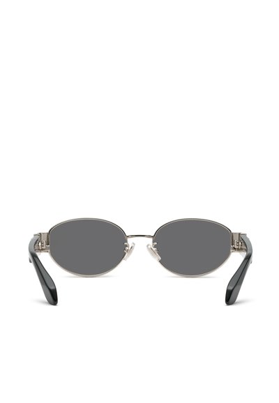 Lunettes de soleil ovales noires avec des fines montures en métal argenté et des branches noires courbées, vues de face sur fond blanc.