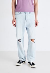 Light blue, distressed denim jeans with large rips at the knees. Straight leg design, featuring a classic five-pocket style and belt loops.