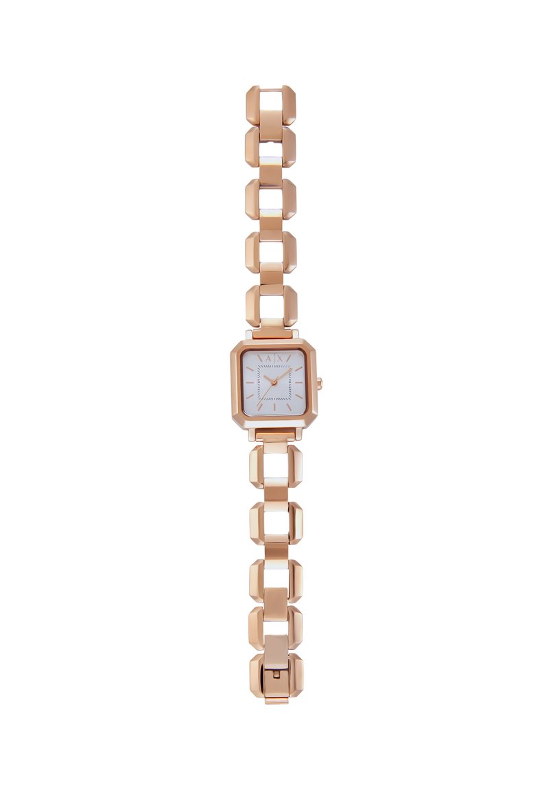 Montre en métal rose gold avec un boîtier octogonal, un cadran blanc et un bracelet à maillons alliant des éléments lisses et angulaires.