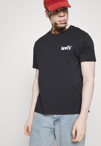 Levi's® RELAXED FIT - T-shirts med print - caviar