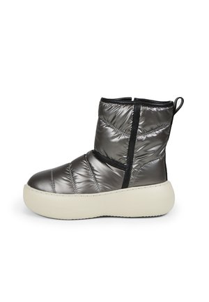 Puffer ankle boot in metallic gray with quilted texture, black elastic accents, and a chunky white sole. Features a pull tab on the back.