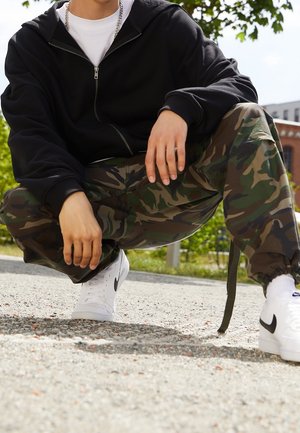 Tröja med dragkedja - black