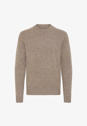 Pull léger marron clair à manches longues en tissu tricoté texturé. Il présente un col rond et une coupe décontractée, idéal pour les superpositions.