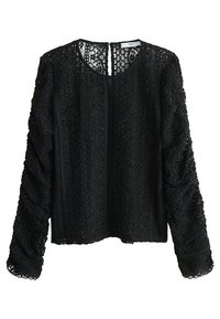 Blouse en dentelle noire avec de longues manches froncées, un col rond et un motif floral texturé sur l'ensemble du tissu.