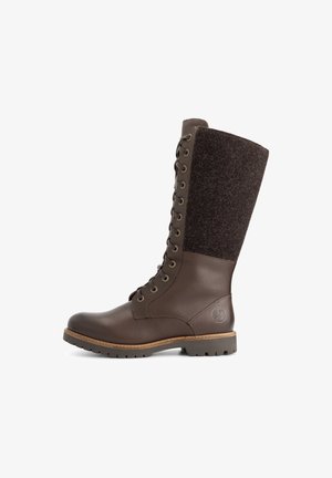 Hohe braune Leder- und Woll-Schnürstiefel mit robustem Profil und runder Zehenform, Seitenansicht vor weißem Hintergrund.