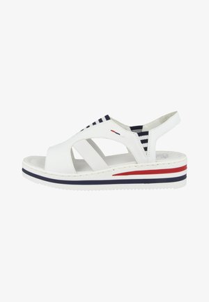 White open-toe sandal with elastic straps, featuring a wedge sole. The sole has red, white, and blue horizontal stripes. Textured finish.