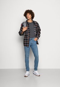 Nudie Jeans GRIM TIM - Calças de ganga justas - blue age