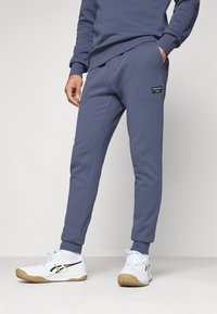 Björn Borg CENTRE TAPERED PANTS - Treniņtērpa apakšdaļas - odyssey gray
