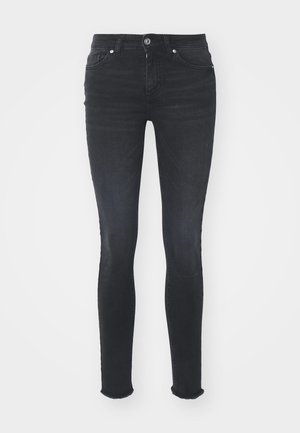 Zwarte denim skinny jeans met een middelhoge taille, vijf zakken en een franjerand. De stof heeft een gladde textuur met een lichte rek.