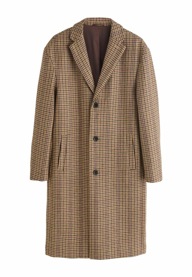 Pruun ruuduline pikk mantel lõhikuga krae, viie nupu, küljetaskute ja siledalt vooderdatud, tumedat tooni voodriga.