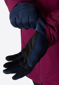 Marinehandschuhe mit strukturierten schwarzen Handflächen für besseren Grip, aus einem weichen, dehnbaren Material gefertigt. Das Design zeichnet sich durch eine enge Passform und bewegliche Finger aus.