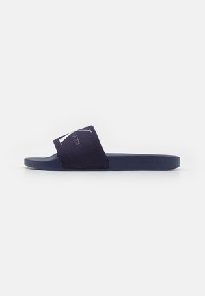Calvin Klein Jeans SLIDE MONOGRAM - Sandalias planas - navy