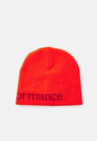 Red knit beanie hat with a close-fitting design. Features dark blue text spelling "performance" along the hem. Soft texture.