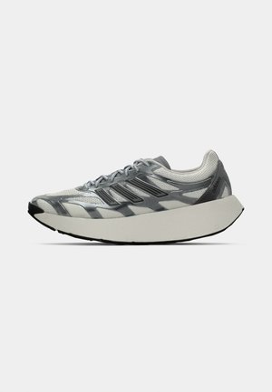 Men’s gray and white athletic running shoe with thick cushioned sole and synthetic overlays, showing side profile on white background.