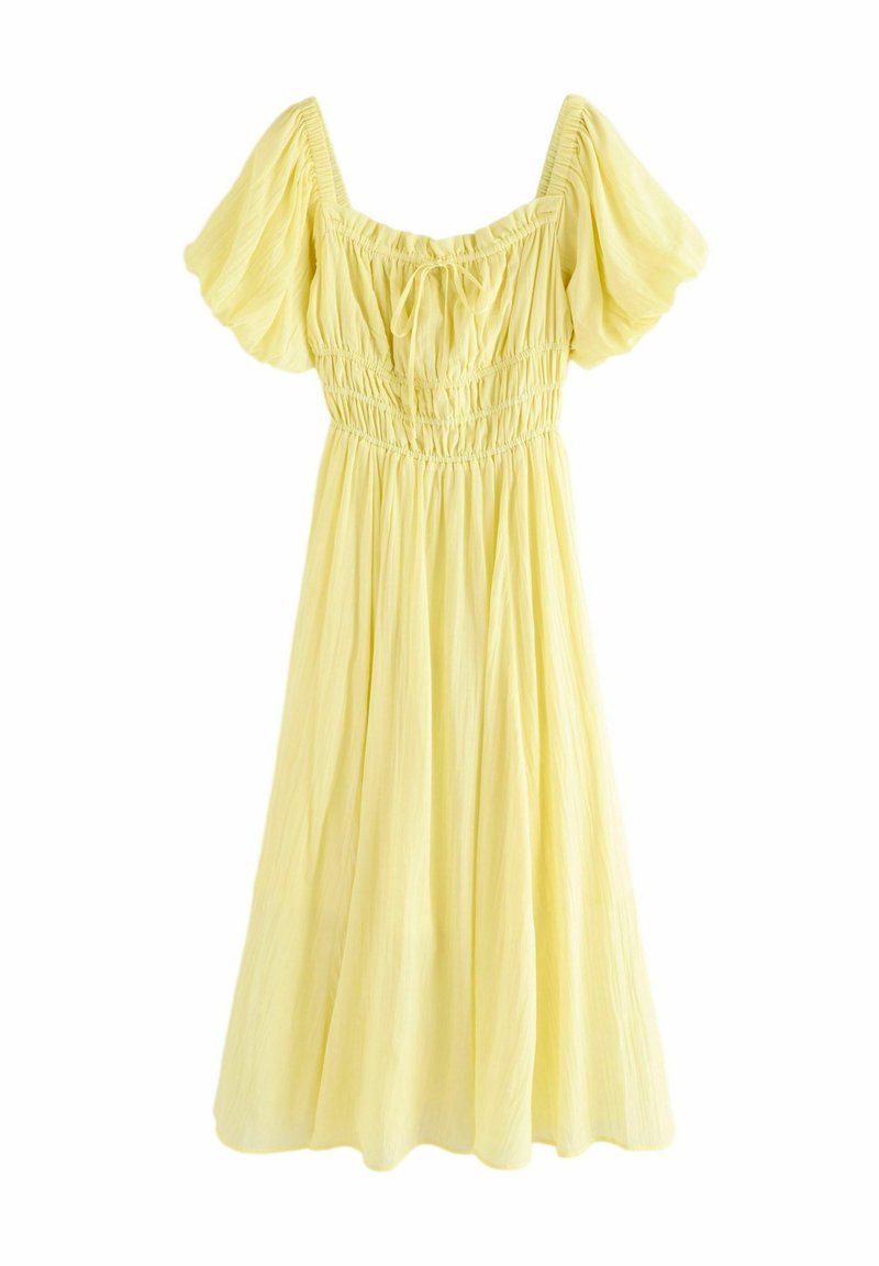 Robe jaune à manches bouffantes avec encolure carrée, bustier smocké et jupe fluide. Fabriquée en tissu léger et texturé.