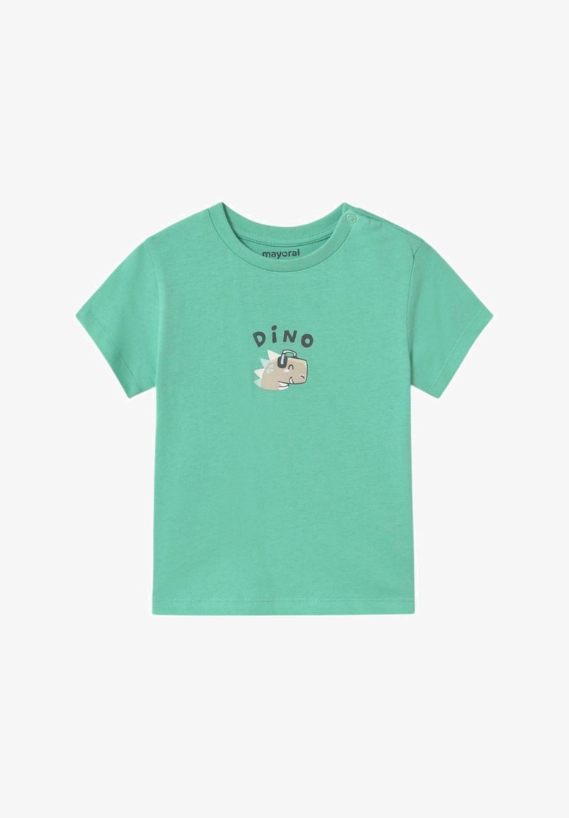 Camiseta de manga corta color verde menta con un gráfico de dinosaurio y la palabra "DINO" impresa arriba. Material suave de algodón con cierre a presión en el hombro.
