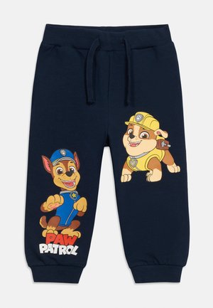 Pantaloni della tuta per bambini di colore blu navy con i personaggi di Paw Patrol Chase in uniforme blu e Rubble con tuta da lavoro gialla.