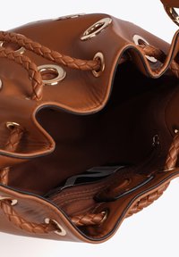 Brown leather bucket bag with braided handles, gold grommets, and a lined interior featuring a zippered pocket and a brand tag.