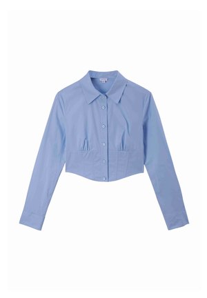 Cropped button-up shirt in light blue, featuring a collar, long sleeves, and subtle gathered detailing at the waist. Smooth cotton fabric.