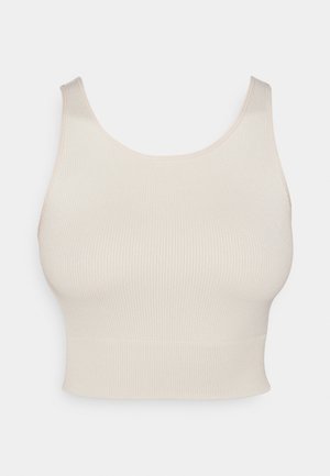 Beige ribbed crop top with wide straps, a round neckline, and a fitted waist. The texture is smooth, with a stretchy, lightweight fabric.