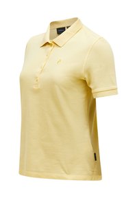 Polo in un giallo chiaro, realizzato in tessuto morbido. Presenta un colletto, maniche corte e un piccolo logo sul petto. Vestibilità classica, design minimal.