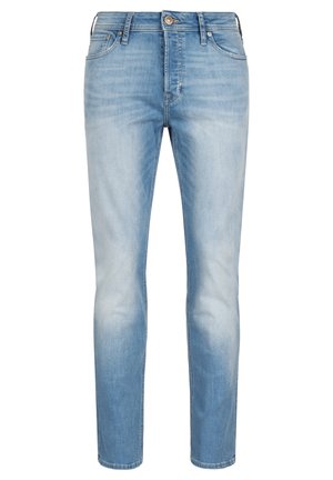 Hellblaue Denim-Jeans mit schmaler Passform, ausgestattet mit einem Knopfverschluss, fünf Taschen und dezenten Abnutzungen auf der Vorderseite für Textur.