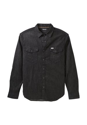 Chemise en jean noire à manches longues avec col, boutons-pression sur le devant et deux poches poitrine boutonnées avec une petite étiquette Timberland.