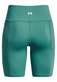 Pantalones cortos deportivos verdes con una textura suave y elástica. Cintura alta con logo en contraste. Incluye bolsillos laterales y costuras sin juntas.