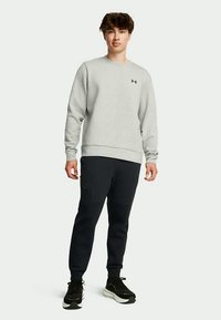 Under Armour UNSTOPPABLE FLEECE - Pantaloni de trening - black