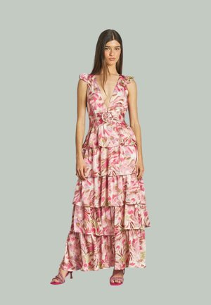 Floral maxi dress in pink and cream hues with layered ruffles. Features a deep v-neck and a circular belt accent. Smooth fabric texture.