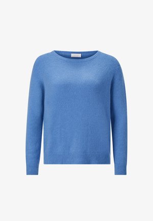 Heled sinine särk, mis on valmistatud pehmest kudumist, omades ümmargust kaelust ja pikki varrukaid ribatud mansettide ja ääristega.