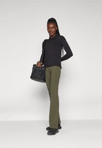 Champion ICONS HIGH WAIST FLARE LEGGINGS - Tamprės - dark green