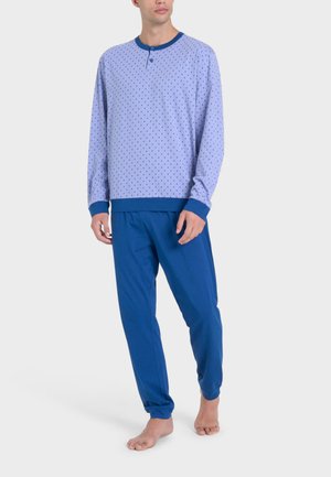 Completo pigiama da uomo composto da una maglia a maniche lunghe di colore azzurro chiaro con pois e pantaloni blu con vita elastica e polsini.