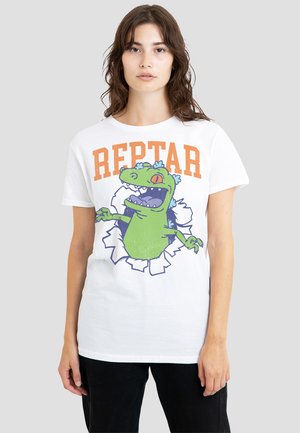 White cotton t-shirt featuring a graphic of a green dinosaur breaking through a torn background, with "REPTAR" in orange above.