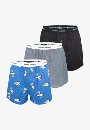 Boxershortset in blauw met pelikaanprint, grijs met subtiele textuur en zwart. Voorzien van elastische taillebanden met het label "HAPPY SHORTS".