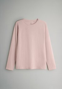 Šviesiai rožinė ilgomis rankovėmis marškinėliai pagaminti iš minkštos medvilnės. Yra apvalios iškirptės ir laisvo kirpimo, tiesus apvadas ir be matomų raštų.