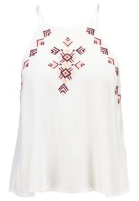 Biała bezrękawnik o luźnym kroju, z misternym wielokolorowym geometrycznym haftem z przodu. Lekki materiał o teksturowanym wykończeniu.