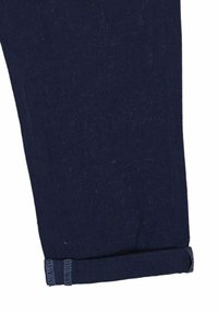 Marinblå denimbyxor med rak passform, med en rullad fåll och subtil textur. Tillverkade av bomullsblandat tyg.