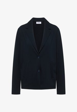 Blazer noir ajusté avec revers crantés, deux boutons et poches latérales fendues, étiquette "CECIL" à l'intérieur du col.