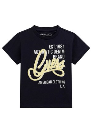 T-shirt nera a maniche corte con scritta gialla "Guess" e testo bianco "EST. 1981 Authentic Denim Brand American Clothing L.A."