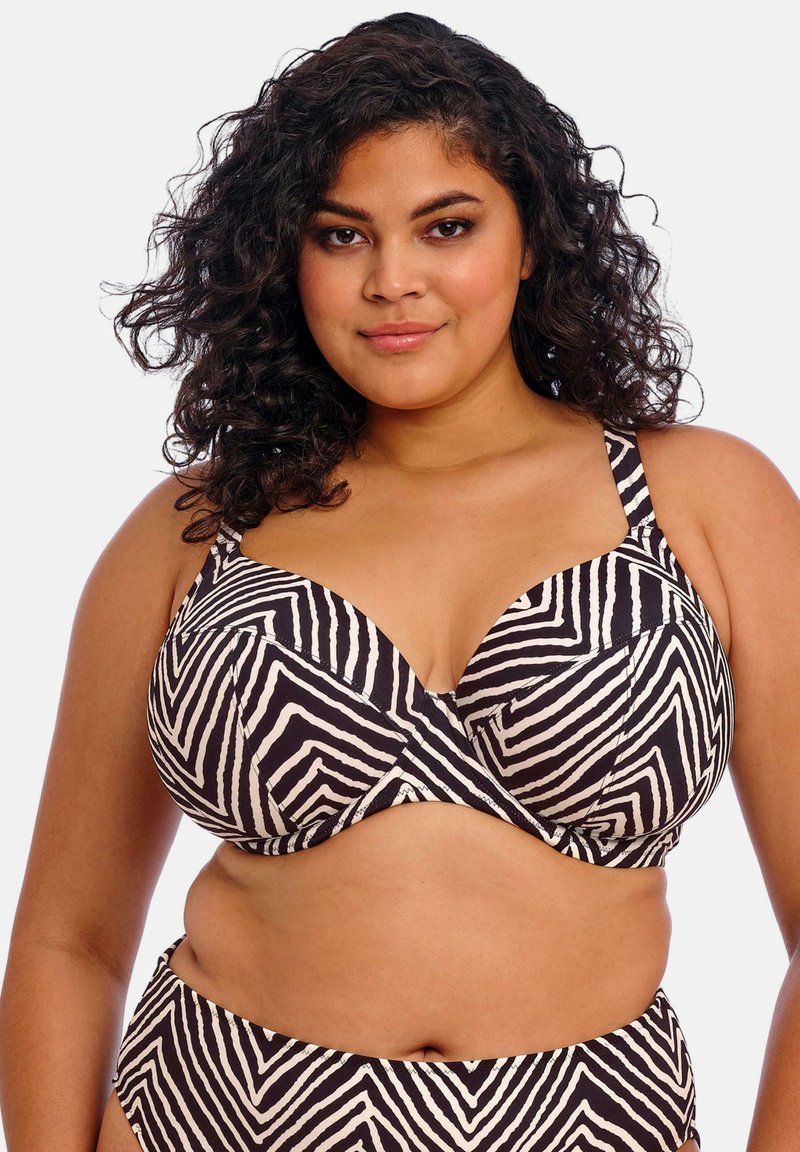 Musta-valkoisia raidoitettu bikini, jossa on chevron-kuvio, varustettuna rintaliivimäisillä kuppeilla, leveillä olkaimilla ja sileällä, istuvalla pinnalla.